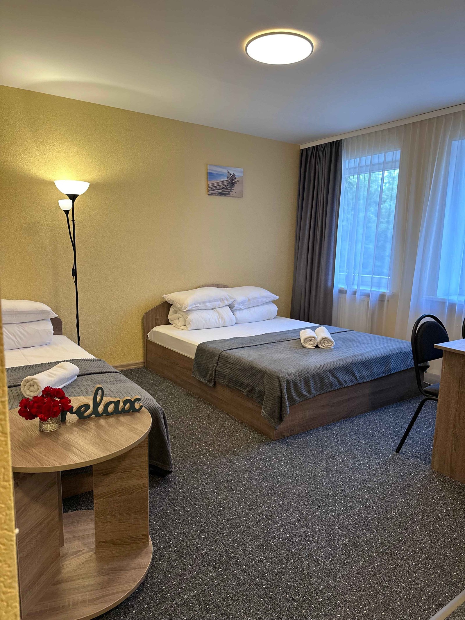 Triple comfortable room with one double bed and one single bed.
